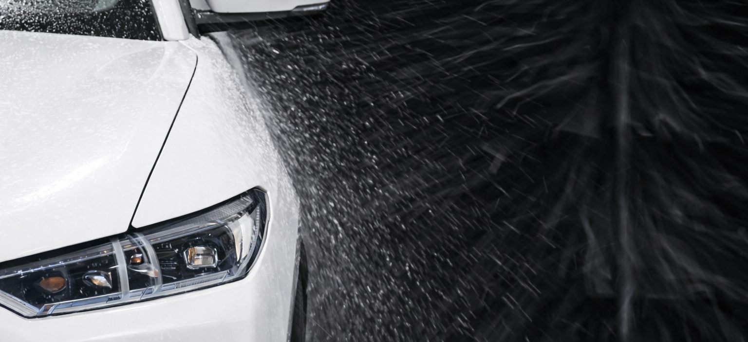 car getting washed by touch free oasis car wash