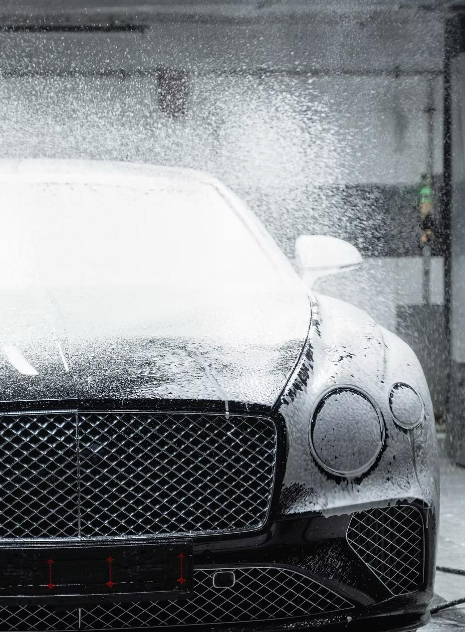car getting cleaned with mcclean car wash chemicals